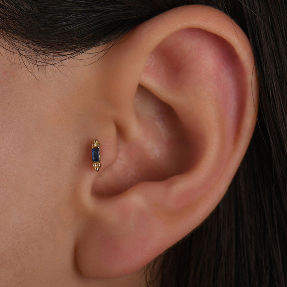 0.06 Carat Baguette Sapphire Piercing