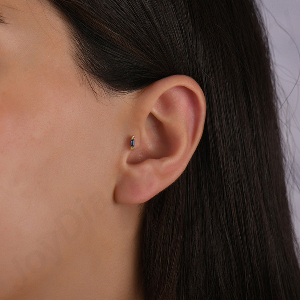 0.06 Carat Baguette Sapphire Piercing