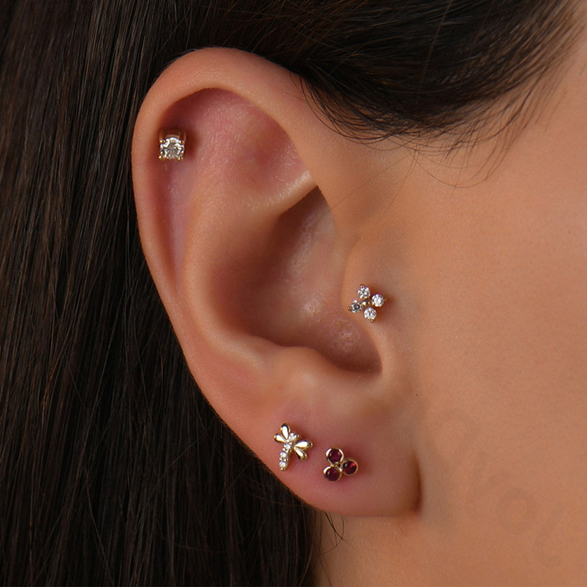 0.09 Carat Three-Stone Ruby Piercing
