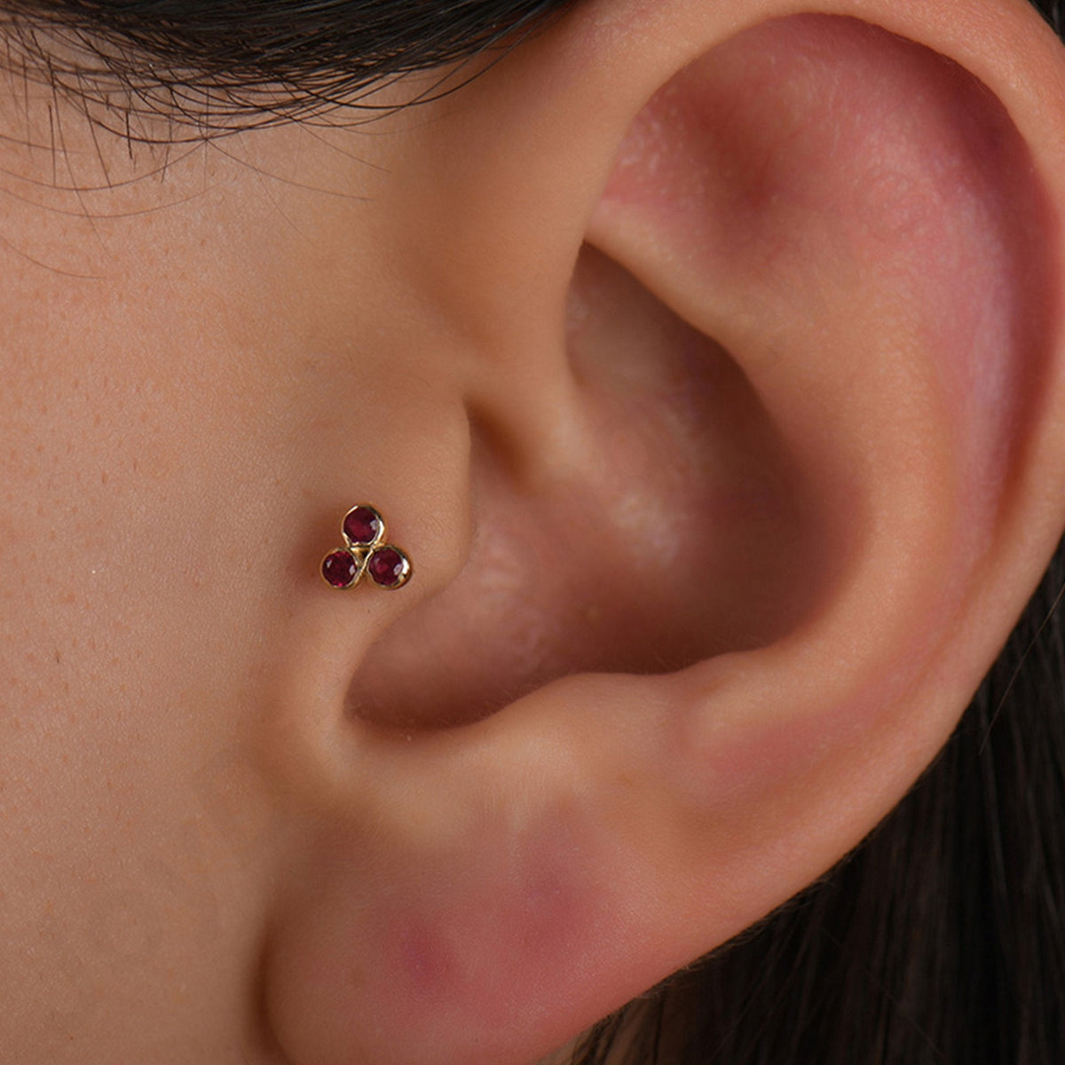 0.09 Carat Three-Stone Ruby Piercing