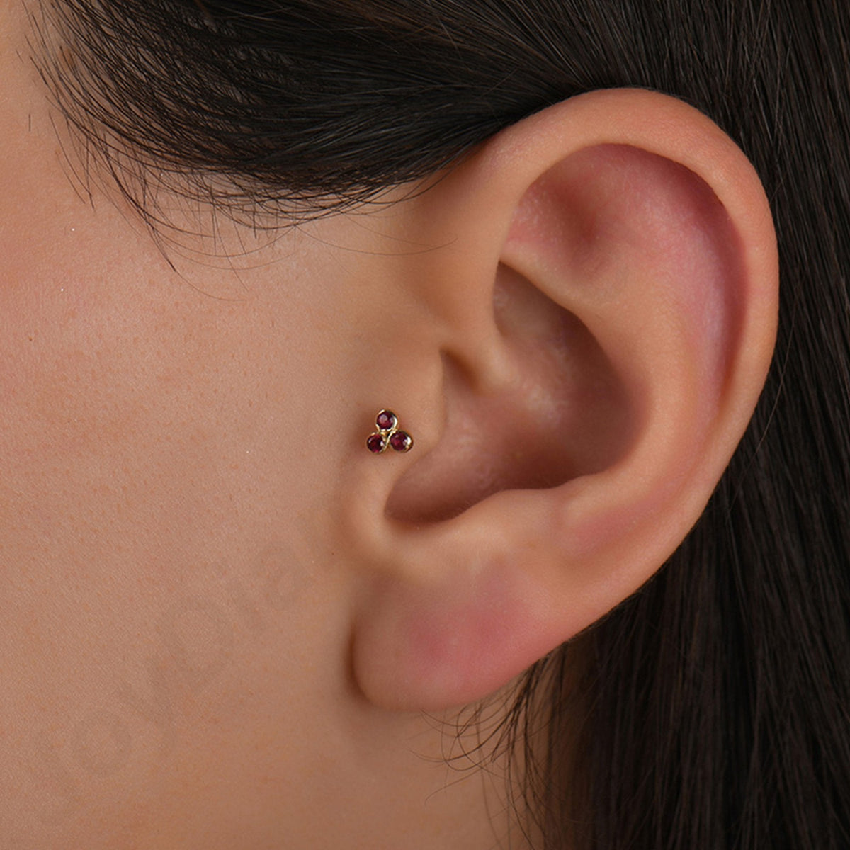 0.09 Carat Three-Stone Ruby Piercing