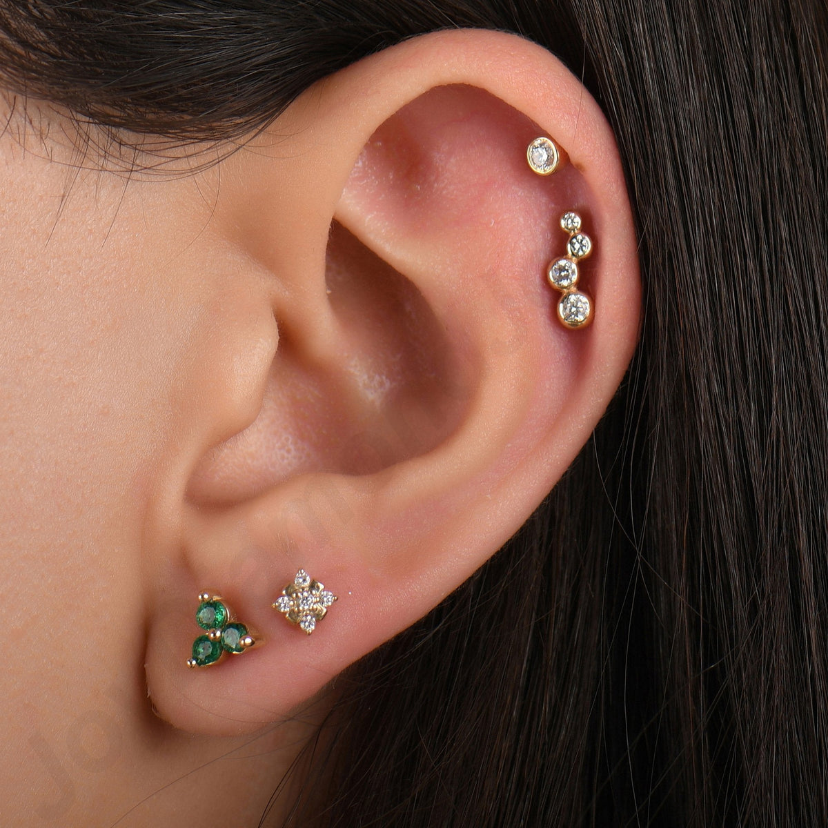 0.15 Carat Three-Stone Emerald Piercing