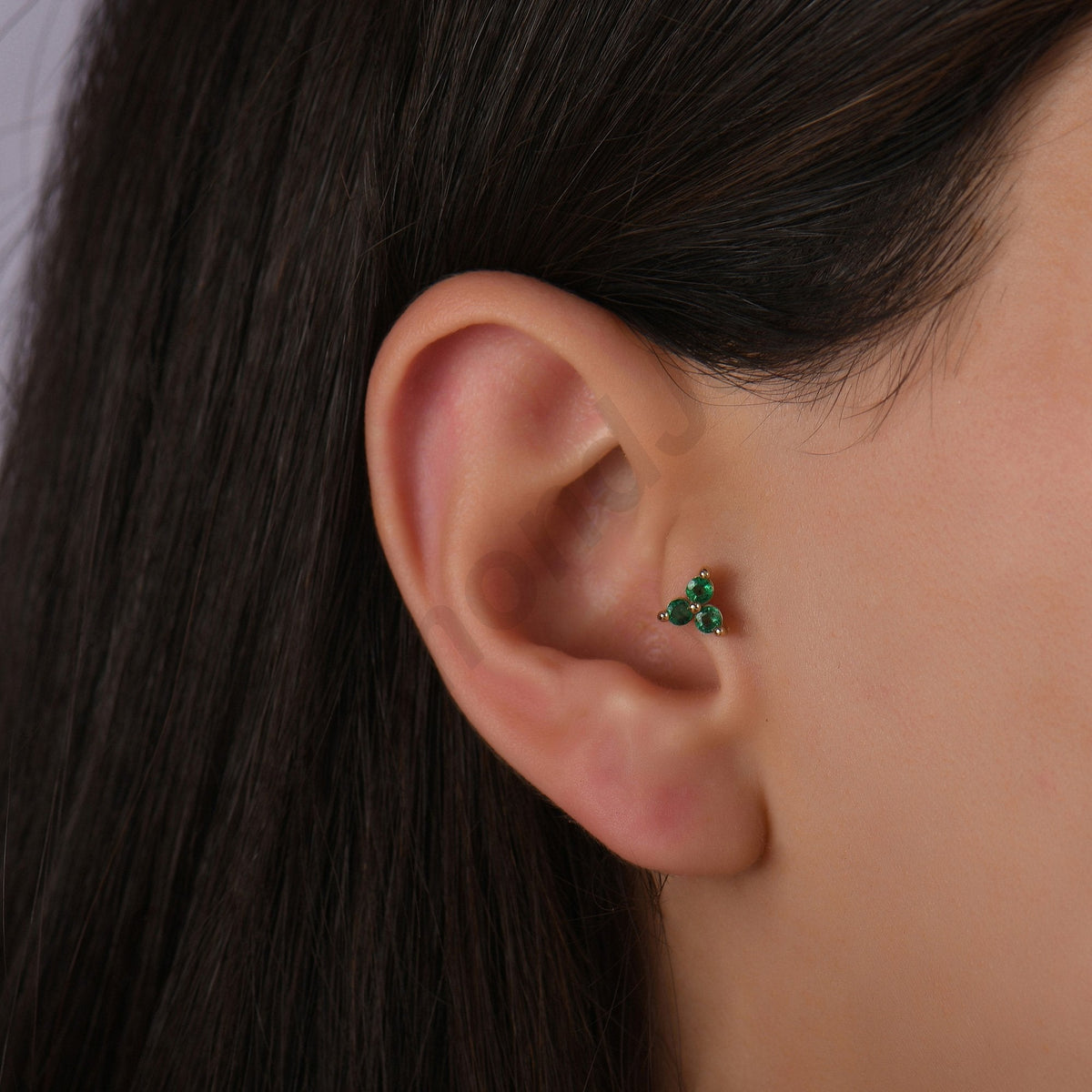 0.15 Carat Three-Stone Emerald Piercing