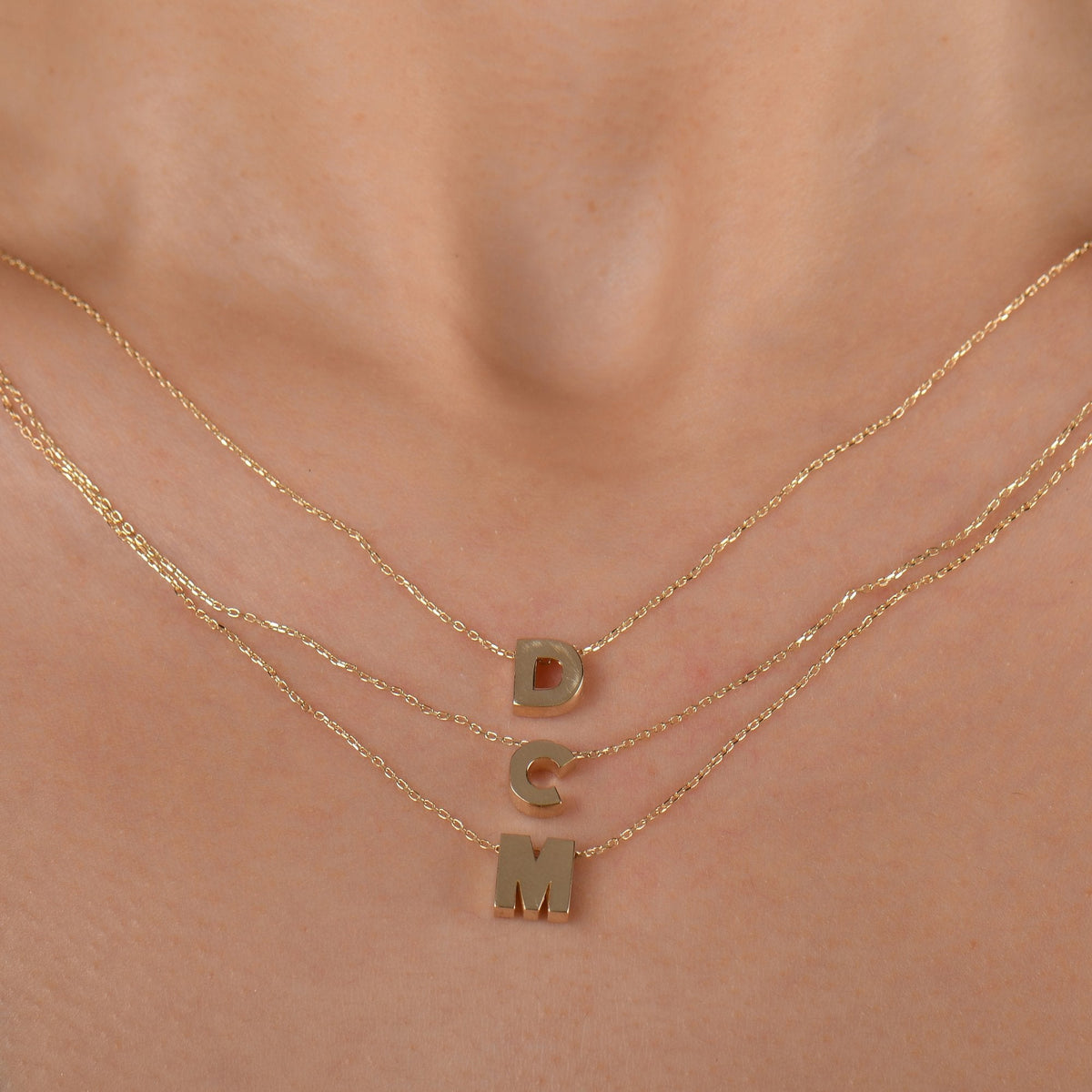 Gold Initial Necklace · Letters D, C and M